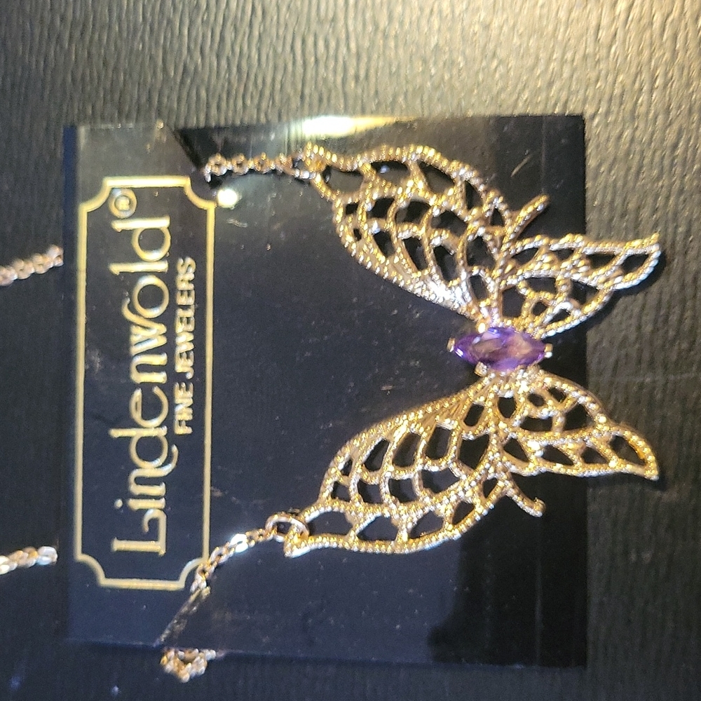 Gold filigree butterfly pendant with purple rhinestone